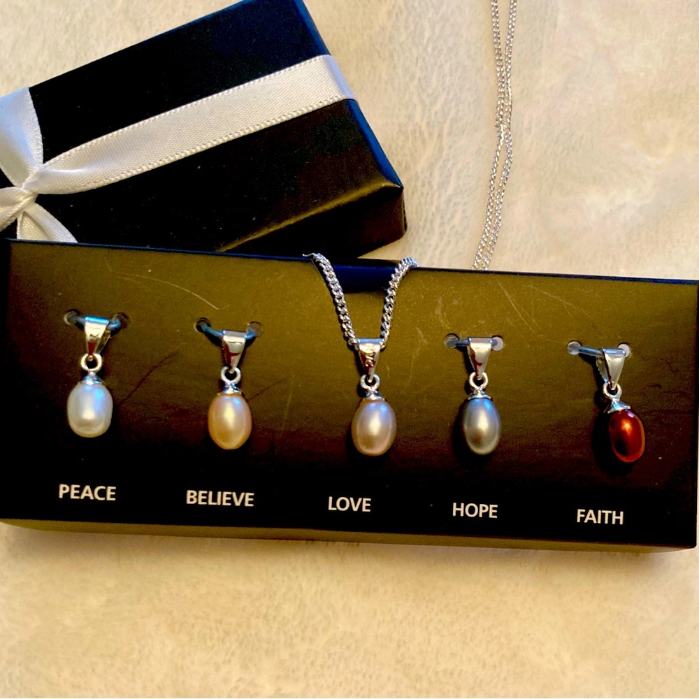 Avon Necklace- peace, believe, love, faith.